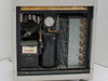 Interior view of lower access compartment showing aged yellow foam insulation panel covering the refrigeration section