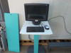 Control workstation for TTP Labtech comPOUND CM601 showing flat-panel monitor, keyboard, and mouse on pedestal stand