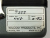 Wilcom T355 optical transmitter bottom label showing model T355, serial 448, date 5-92, Wilcom Products Inc Laconia NH Made in USA