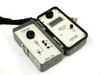 Wilcom T319 optical level meter and T355 optical transmitter side by side showing front panel controls and displays