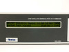 Newtec DVB-2063 LCD display close-up showing 'NEWTEC DVB+8+16 Demod. v1.60 14 Nov 2000 / system test passed' and 'DVB SATELLITE DEMODULATOR (1.41-45MBAUD)' label