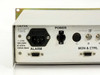 Newtec DVB-2063 rear panel left-side close-up showing power inlet label (100-240V, 47-63Hz, 150VA MAX), ALARM DB9 connector, power on/off rocker switch, and IF BNC inputs C/B/A