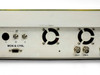 Newtec DVB-2063 rear panel right-side close-up showing IF BNC inputs, two cooling fans, COAX1 and COAX2 BNC outputs, MON & CTRL DB9, and SUB-D connector