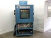 Thermotron SM-16-SL environmental test chamber front view with lower panel open exposing control wiring harness and relay bank, door closed