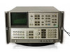 HP Agilent 8566B Spectrum Analyzer front 3/4 angle — both units stacked, live spectrum trace visible on CRT display