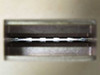 Varian F137CA2 WR-137 waveguide — macro close-up inside the rectangular waveguide aperture showing interior bore and internal pin/probe detail