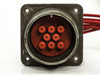 CPI Satcom Gen IV HV Module 01026320 – closeup of 8-pin military circular connector face showing red pin inserts and four-hole mounting flange