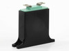 Panasonic 32EK241 ZNR varistor angled rear view showing molded black base mounting feet and green disc assembly