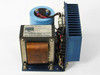 Standard Power SPS 120-15 linear power supply — opposite side three-quarter view showing transformer, capacitor, output terminal block, and heatsink