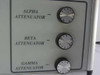 Right side panel showing three stepped rotary attenuator knobs labeled Alpha, Beta, and Gamma Attenuator