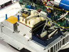 Varian 01016541-02/G Regulator Panel Assembly interior top-down view showing PCB components, blue capacitor, dual fans, and transformer assembly