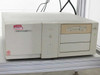 Dell Dimension XPS P100s desktop PC tower included with Synrad Fenix Flyer laser marking system, showing floppy drive and CD-ROM drive