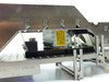 US Vibra 2028-A internal drive assembly – under-track view showing electromagnetic coil/driver with yellow caution high-temperature label and TO-263 marking on track underside