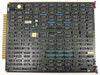 Hughes 2470-II Wire Bonder control card — black PCB with gold edge connector, densely populated with DIP ICs and discrete components