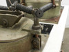 Close-up of single T-bolt fastener and pivot mechanism on left vacuum chamber lid