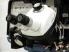 Hughes 2460 Wire Bonder – Bausch & Lomb stereo binocular microscope head close-up showing dual eyepieces and objective