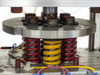 Custom heated pneumatic press on work table – three-quarter front view with power cable coiled on table surface