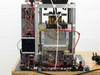 Detail of pneumatic base manifold showing pressure regulator, solenoid valves, fittings, and wiring connections