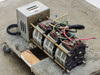 Superior Electric Powerstat 136-1033 — left-side view showing three toroidal cores, terminal block wiring (green, blue, pink leads), and motor operator enclosure