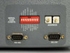 XTC-140D rear panel serial communications config section showing C/K DIP switch bank, ADDRESS potentiometers, RS-485 and RS-232 DB9 connectors