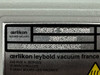 Leybold SOGEVAC SV65 BI FC — close-up of data plate showing model SV65BIFC, part number 960465V3001, serial number 310001264801, and configuration code 960465VB2E3B3AA2A3A2C