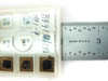 Entegris H20-551 wafer chip tray with cover open showing 9-slot grid — ruler alongside for scale indicating approximately 2-inch tray size