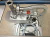 Balzers Pfeiffer DUO 016B top-down view showing stainless steel KF inlet fitting with clamp, flexible vacuum hose, and exhaust port connections