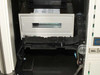 Interior view of EXB-10 enclosure showing tape drive module seated in autoloader chassis with belt mechanism