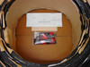 Interior of Uni-Solar PVL-144 carton showing rolled panels, installation instruction sheet, and bag of MC3 connector accessories