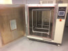 Shanghai HS2.5 chamber interior — door open showing stainless steel walls, removable wire mesh shelving rack on wheels, and door-mounted observation window