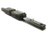 THK YN8F1-A linear guide rail, 52cm long, with two block carriages mounted — full side view showing rail and carriage assembly