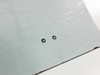 Close-up of Uni-Solar PVL-64 top surface showing two exposed solder connection points on the light gray flexible laminate