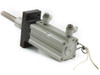 SMC MK2B50L-70-DCK7869K rotary clamp cylinder rear-right view showing cylinder body, flange plate, push-in fittings, and extended shaft with trailing sensor wire