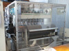 Interior slitter section view – six Tidland Performance Series Class II knife cutters with pneumatic actuators over black slitter roll