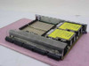 Sun Microsystems 525-1387-19 SPARC CPU Memory Board – rear angle view showing large edge connector at bottom, full memory slot bank, two yellow Sun-labeled modules, and metal chassis frame
