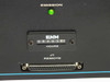 Spectra-Physics R2-740 front panel close-up showing green Emission indicator LED, ENM hour meter reading 08263 hours, and J1 Remote D-sub connector