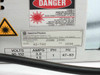 Spectra-Physics R2-740 rating plate showing model R2-740, manufactured June 1996, 90-132V, 3.0A / 1.5A, 1PH, 47-63Hz, with laser danger warning label