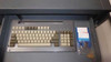 ElectronCure 30X integrated keyboard drawer – slide-out drawer with vintage keyboard and floppy disk drive, with floppy disks visible alongside