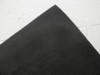 Close-up of Xunlight XRS19-158 flexible solar panel corner showing matte black surface texture and flexible laminate backing