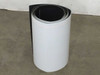 Xunlight XRS18-150 flexible solar panel rolled tightly showing white ETFE front surface — upright side view