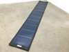 Xunlight XLS11-72 72W flexible solar panel fully unrolled on floor showing all 11 thin-film solar cells