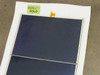 Xunlight XLS8-52 flexible amorphous solar panel laid flat showing two-cell array, exposed metal tab connector, and Quality Hold label