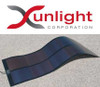 Xunlight Corporation logo and product photo showing XLS11-45 flexible solar panel curved over a rooftop surface with output leads
