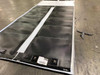 Xunlight XRS5-42 42W flexible amorphous solar panel — close-up of untrimmed panel sheet showing amorphous cell surface, white border framing, and label/barcode tags at bottom edge