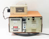 Tegal PlasmaLine 200 rear panel overview — DANGER HIGH VOLTAGE placard on Tegal RF section, right-side panel with J2 connector and fuse holders