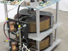 Staco 30M6020-2P variac — close-up of front-left side showing Staco Energy fuse blocks at positions 1 and 4, frame label reading STACO ENERGY DAYTON, and toroidal winding detail