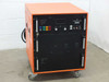 Lambda Physik EMG 102 MSC excimer laser power supply — front-left three-quarter view showing orange cabinet, front control panel, and caster base