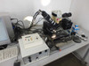 Finetech Fineplacer system overview from left angle showing two-axis stage, Leica MZ6 microscope head, Sigma Koki SHOT-102 stage controller, and PC workstation