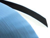 Close-up edge view of Quanex Solargain butyl edge tape roll showing blue release liner and black butyl rubber layer cross-section