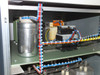 Upper interior compartment of Berger PSS10 showing toroidal transformer, relay/contactor bank, and wiring harness with blue/red/yellow cables
